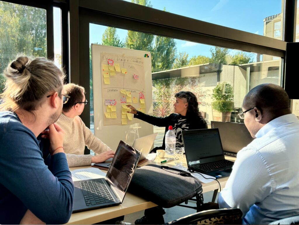 Business intelligence team planning a practical data governance implementation strategy