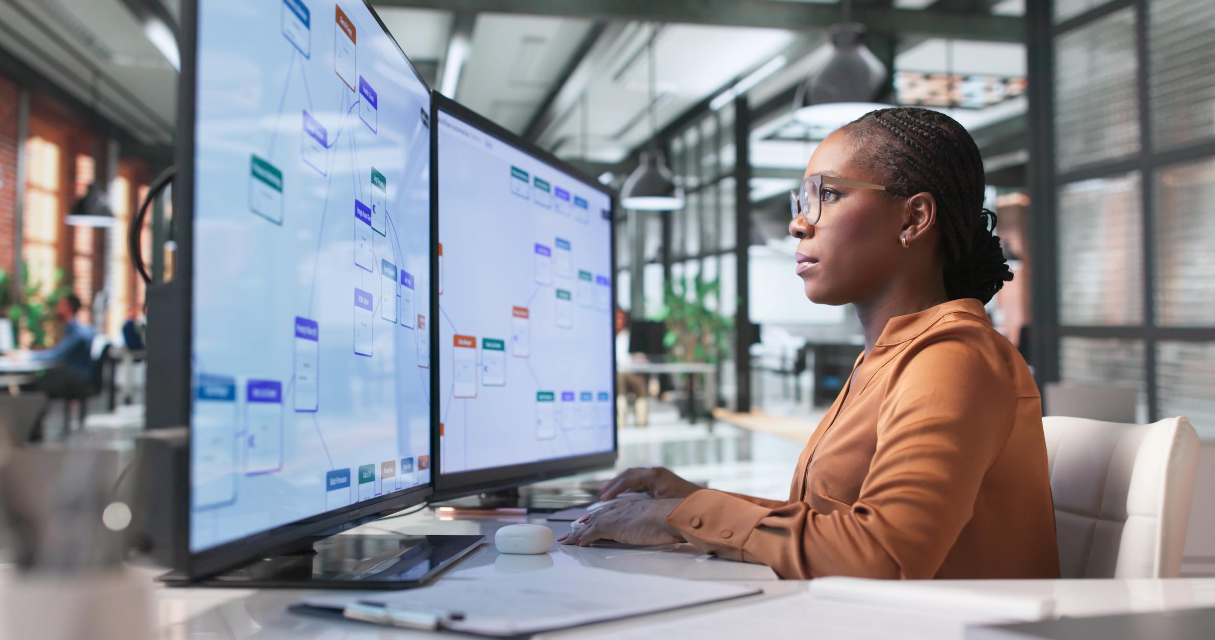 Business operations analyst reviewing a process mining workflow before automation