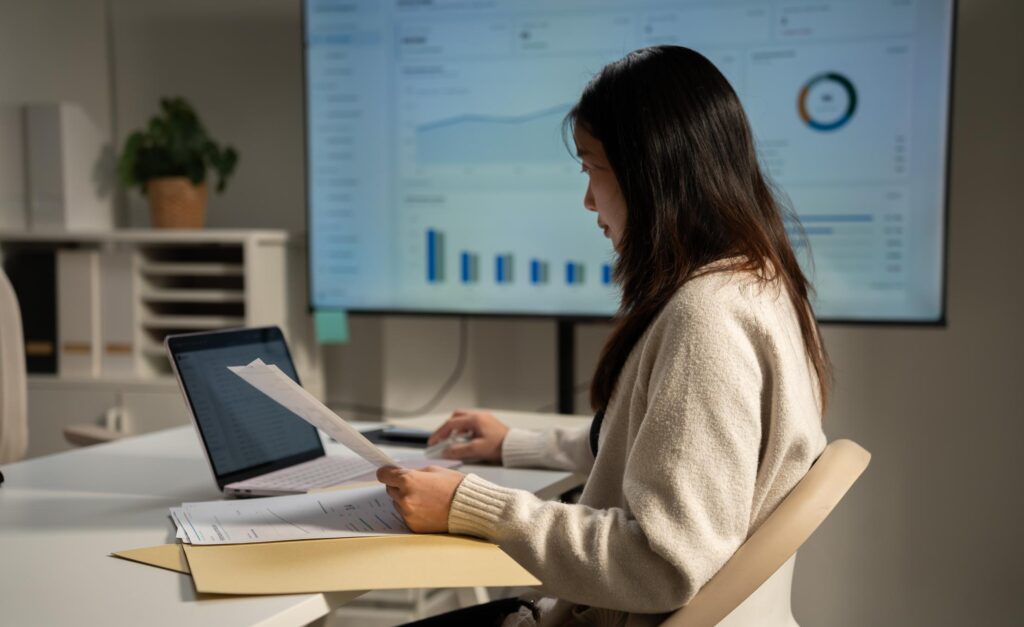Business professional reviewing digital documents for governed enterprise information retrieval