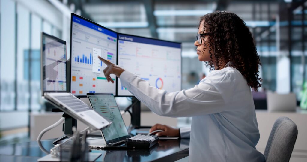 Data analyst testing dashboard filters and cross filter interactions across business intelligence visuals