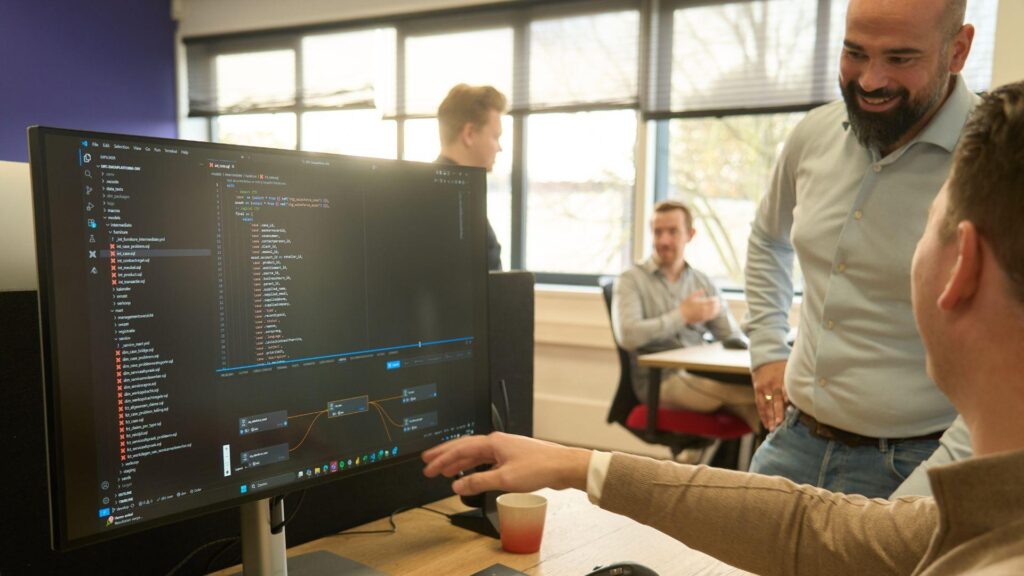 Data engineering team reviewing dbt analytics engineering and data warehouse workflows