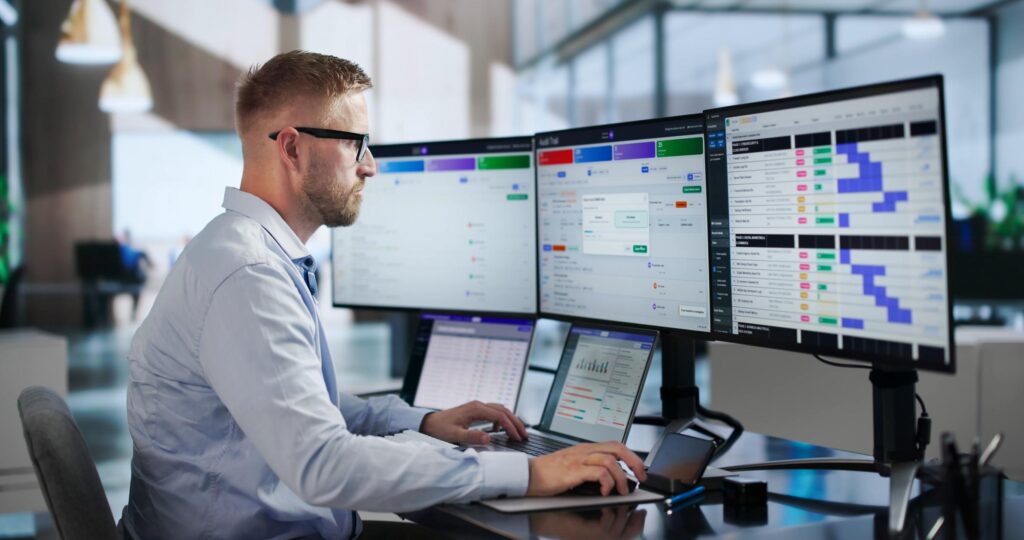 Data operations professional monitoring action logs, workflow outcomes and system activity